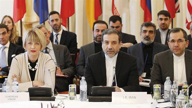 Iranian Deputy Foreign Ministers Majid Takht-e-Ravanchi and Abbas Araqchi (1st R and C), and European Union Political Director Helga Schmid are seen at a meeting of the joint JCPOA commission in Vienna, October 19, 2015. (Photo by AFP)