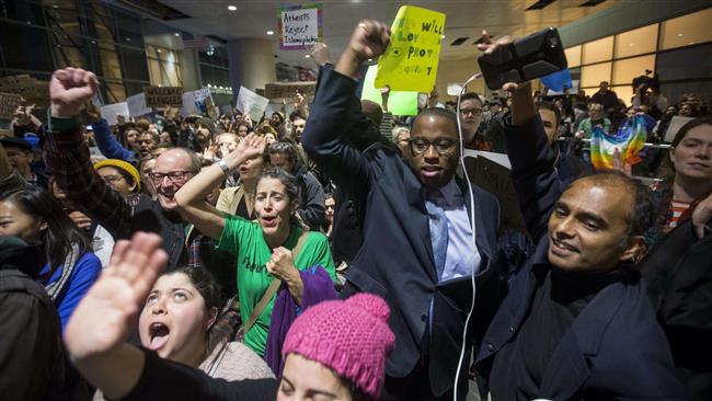 Protestors rally at a demonstration against the new ban on immigration issued by US President Donald Trump at Logan International Airport on January 28, 2017 in Boston, Massachusetts. (Getty Images)