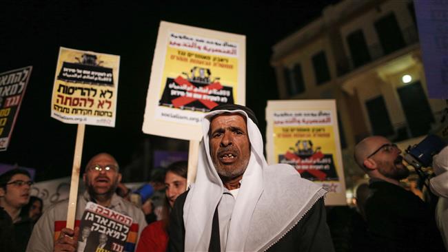 Palestinians and Israelis participate in a demonstration against Israeli Prime Minister Benjamin Netanyahu and against the home demolition policy, in Tel Aviv on February 4, 2017. (Photo by AFP)