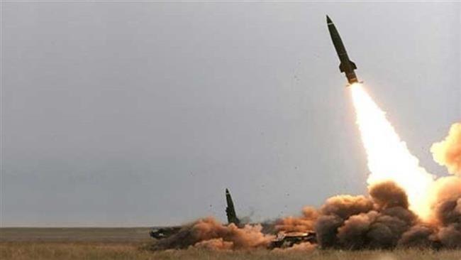 A missile being fired from the direction of Yemen toward Saudi Arabia
