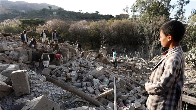 A Yemeni boy looks on as Yemenis search under the rubble of damaged houses following Saudi airstrikes on the outskirts of the capital, Sana’a, on February 1, 2017. (Photo by AFP)