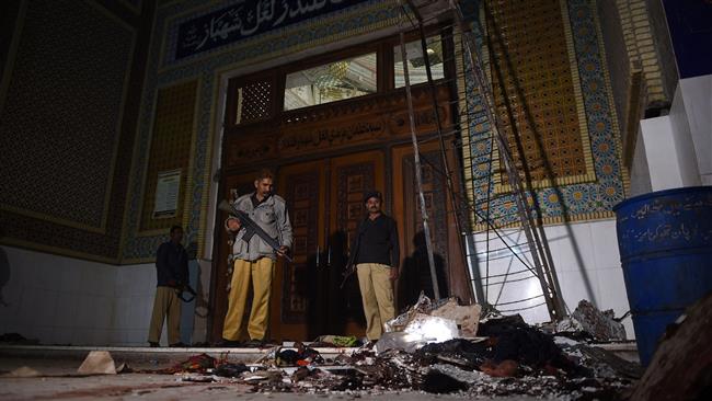 Pakistani security personnel stand guard at the Sufi shrine of Lal Shahbaz Qalandar, a day after a terrorist attack in the city of Sehwan in Sindh Province on February 17, 2017. (Photo by AFP)