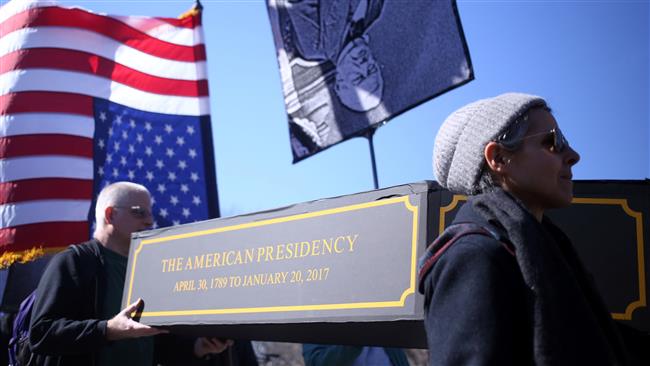 People carry a mock casket during a mock funeral for “the American Presidency” in Manhattan, New York, February 18, 2017. (Photo by Reuters)