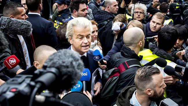 Far-right Dutch Freedom Party leader Geert Wilders (C) speaks to journalists as he officially launches his parliamentary election campaign, in Spijkenisse, February 18, 2017. (Photo by AFP)