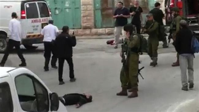 This still grabbed from video released by Isreali human rights group, B’Tselem, on March 24, 2016 shows Israeli soldier, Elor Azaria, aiming his weapon before shooting dead already-subdued Palestinian, Abed al-Fatah al-Sharif, in the West Bank city of al-Khalil (Hebron). (Photo by AFP)