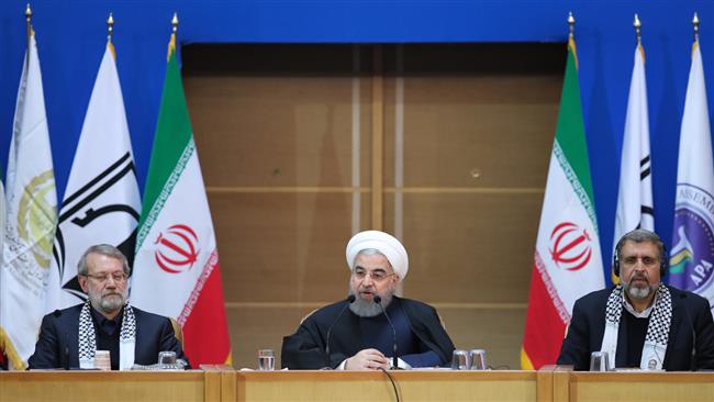 Iranian President Hassan Rouhani (C) addresses the 6th International Conference in Support of the Palestinian Intifada (Uprising) in Tehran on February 22, 2017.