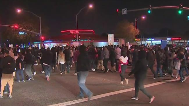 Protesters march towards the home of a white police officer who shot towards an unarmed Hispanic teen on Wednesday, February 22, 2017. (AP photo)