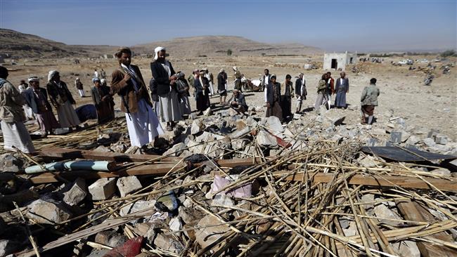 Yemeni men check the site of a Saudi air raid that hit a funeral reception in the Arhab district, located 40 kilometers north of the capital, Sana’a, on February 16, 2017. (Photo by AFP)
