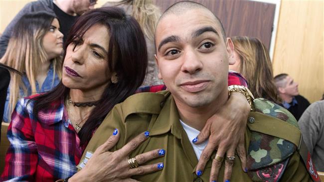 Israeli soldier Elor Azaria (R), who murdered a wounded Palestinian in March 2016, is seen at the start of his sentence hearing in a military court in Tel Aviv on February 21, 2017. (Photo by AFP)