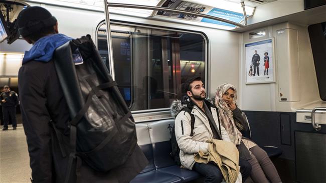 Travelers ride the AirTran to the international terminal at John F. Kennedy International Airport, on March 6, 2017, in New York City. (Photo by AFP)