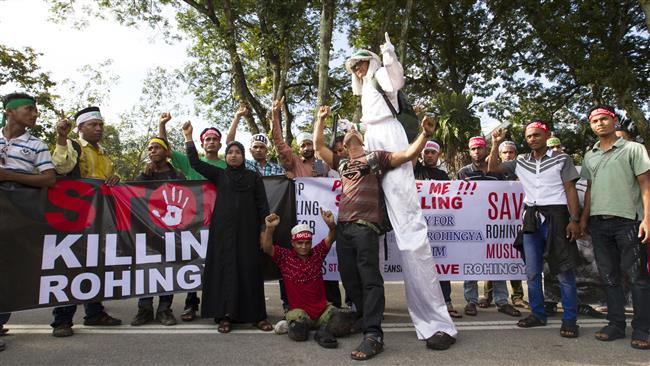 Myanmar ethnic Rohingya Muslims shout slogans during a protest against the persecution of Rohingya Muslims in Myanmar, in Kuala Lumpur, Malaysia, December 4, 2016. (Photo by AP)