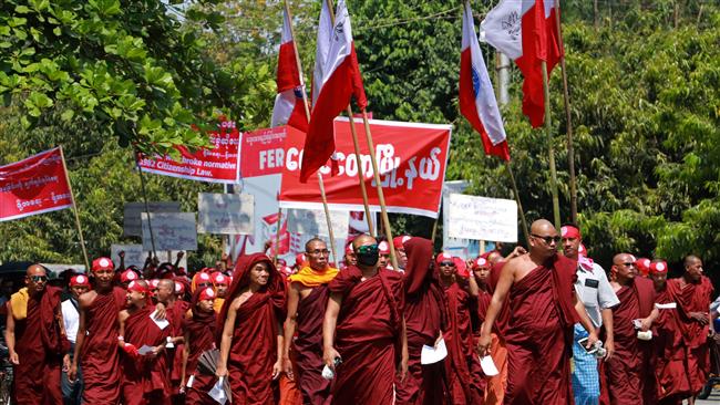 Monks and ethnic Rakhine protesters take part in a demonstration against a government push to speed up the citizenship verification process for the stateless Rohingya minority in Sittwe township, Rakhine state, Myanmar, March 19, 2017. (Photo by AFP)