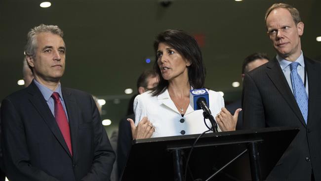 Flanked by French Deputy Representative to the United Nations Alexis Lamek (L) and British Representative to the United Nations Matthew Rycroft (R), US Ambassador to the United Nations Nikki Haley speaks to reporters at the UN headquarters, March 27, 2017, in New York City. (Photo by AFP)