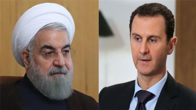 Iran’s President Hassan Rouhani (L) and Syrian counterpart Bashar al-Assad