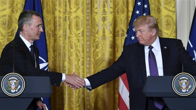 US President Donald Trump (R) and NATO Secretary General Jens Stoltenberg shake hands during a joint press conference in the White House in Washington, DC, on April 12, 2017. (AFP photo)