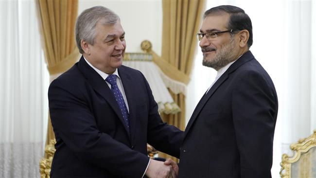 Alexander Lavrentiev (L), who is Russian President Vladimir Putin’s point man on Syria, shakes hands with Ali Shamkhani, the secretary general of Iran’s Supreme National Security Council (SNSC), before their meeting in Tehran, Iran, April 27, 2017.