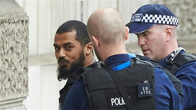British police detain a man near the Houses of Parliament in central London on April 27, 2017. (Photo by AFP)