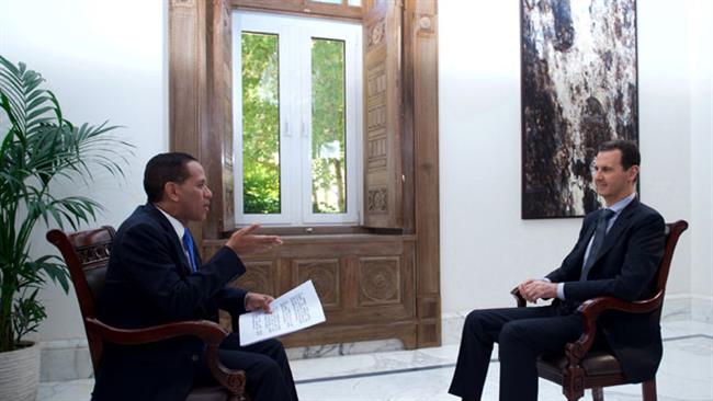 Syrian President Bashar al-Assad (R) speaks in an interview with Venezuela’s Telesur television broadcast on April 27, 2017. (Photo by SANA)