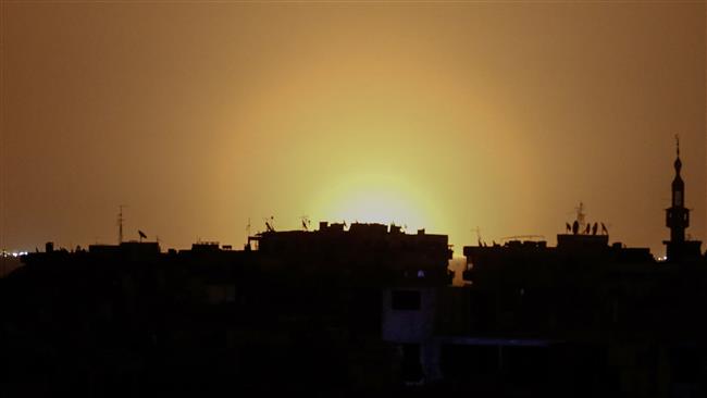 A photo taken from the Syrian town of Douma shows flames rising from Damascus International Airport following an explosion early in the morning of April 27, 2017. (Photos by AFP)