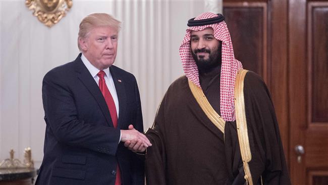 US President Donald Trump and Saudi Deputy Crown Prince and Defense Minister Mohammed bin Salman (R) shake hands in the State Dining Room before lunch at the White House in Washington, DC, on March 14, 2017. (Photo by AFP)