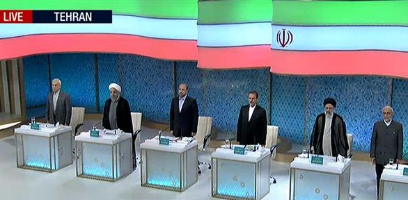 Iranian presidential candidates seen standing before the beginning of a debate in Tehran on April 28, 2016.