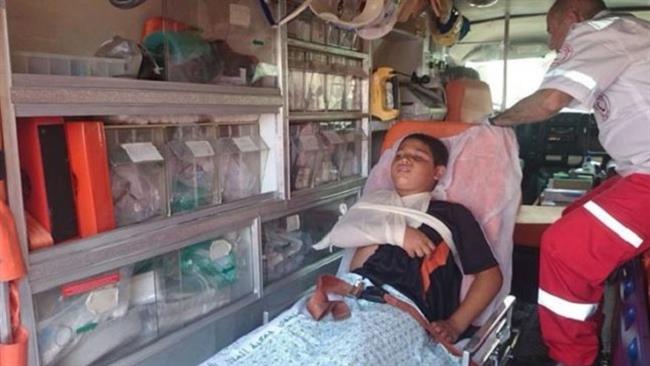 In this file photo, Palestinian child Adam al-Risheq is being rushed to hospital after being run over by a car driven by Israeli settlers in East Jerusalem al-Quds.