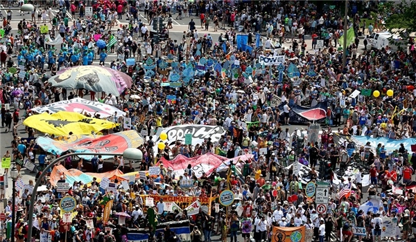 Thousands March against US President Policies