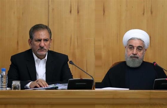 Iranian President Hassan Rouhani (R) and his deputy Es’haq Jahangiri are seen during a cabinet meeting.