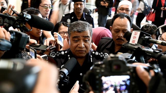 Malaysian Police chief Khalid Abu Bakar (C) speaks to reporters on March 16, 2017. (Photo by AFP)