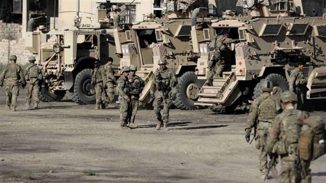 US soldiers are seen next to their armored vehicles near an Iraqi army base on the outskirts of Mosul, on November 23, 2016. (Photo by AFP)