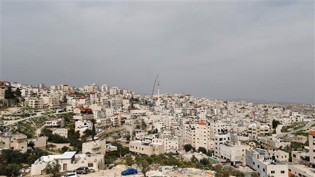 Palestinians install a minaret on a new mosque in the East Jerusalem al-Quds Arab neighborhood of Issawiya, March 17, 2017. (Photo by AFP)