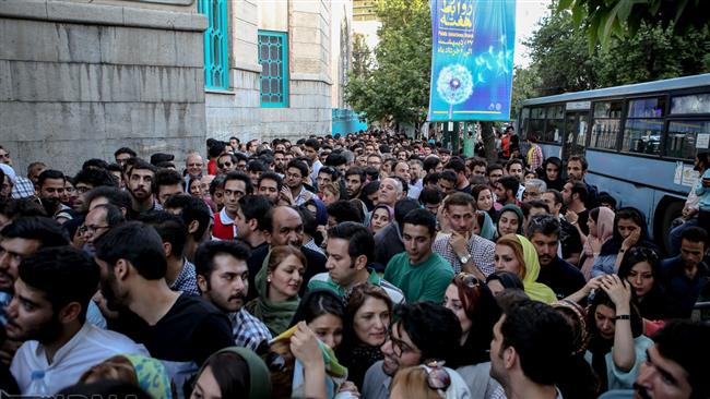 Iranian voters gather outside a polling station in the capital Tehran on May 19, 2017. (Photo by IRNA)