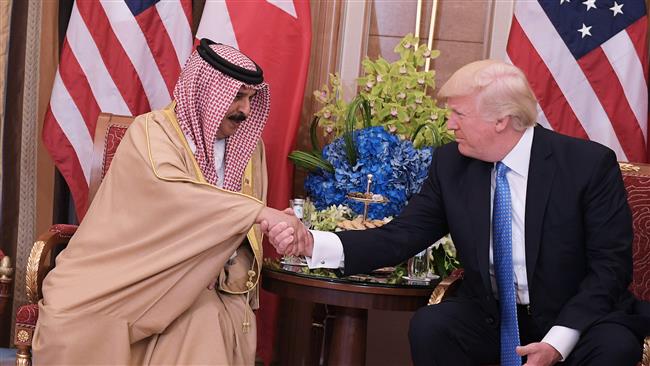 US President Donald Trump (R) and Bahrain’s King Hamad bin Isa Al Khalifah take part in a bilateral meeting at a hotel in Riyadh, Saudi Arabia, May 21, 2017. (Photo by AFP)