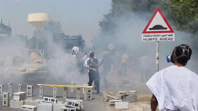 Bahraini anti-regime protesters use cement blocks in a roadway in the northern village of Diraz on May 23, 2017, to prevent Manama security forces from advancing.