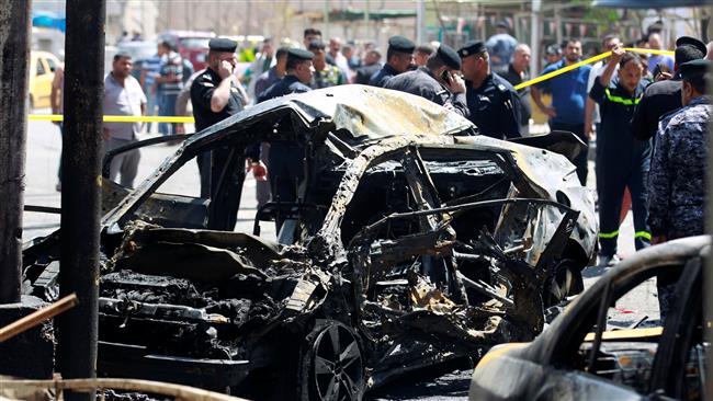 A wreckage of a car is seen at the site of car bomb attack near a government office in Karkh district in Baghdad, Iraq, May 30, 2017. (Photo by Reuters)