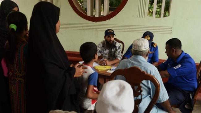 Muslim community members gather at a security center to register complain over hate crimes in Sri Lanka. (Photo by AFP)