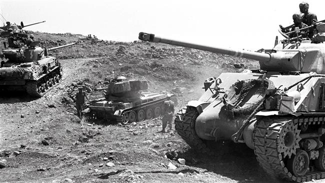 This photo released by Israel shows Israeli tanks advancing through difficult hilly terrain on the Golan Heights on June 10, 1967 during the Six-Day War. (Via AFP)