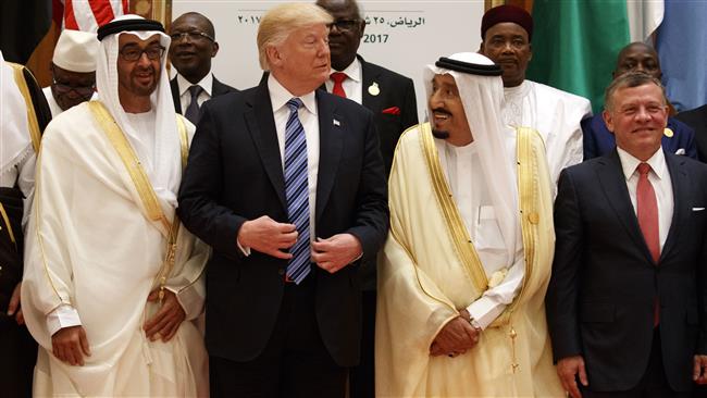 US President Donald Trump (C) talks with Saudi King Salman (2nd R) as they pose for photos with leaders at the Arab Islamic American Summit, at the King Abdulaziz Conference Center, Sunday, May 21, 2017, in Riyadh, Saudi Arabia. (Photo by AP)