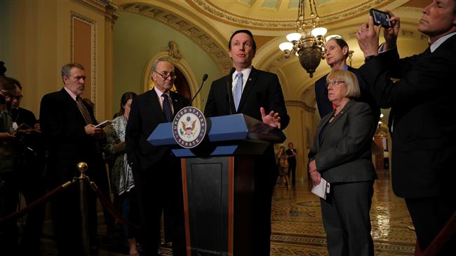 US Senator Chris Murphy along with Senate Minority Leader Chuck Schumer, Senator Ron Wyden, and Senator Patty Murray, speaks to reporters on Capitol Hill in Washington, May 9, 2017. (Photo by AFP)