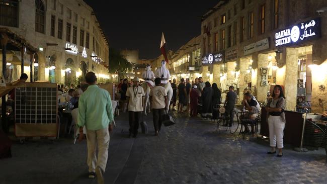 People walk in the popular Souq Waqif market, in the Qatari capital, Doha, June 7, 2017. (Photo by AFP)