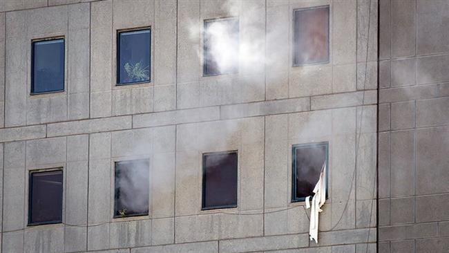 Smoke is seen during a terrorist attack on the Iranian Parliament’s building in central Tehran on June 7, 2017. (Photo by Tasnim news agency)