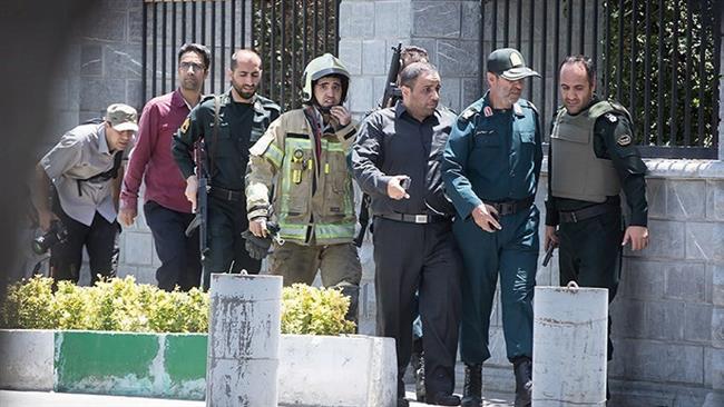 Members of Iranian forces are seen during a terrorist attack on the Parliament in central Tehran, Iran, on June 7, 2017. (Photo by Tasnim news agency)
