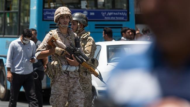 Iranian security forces stand guard in front of the parliament (Majlis) in downtown Tehran after Daesh Takfiri terrorists attacked the Majlis building on June 7, 2017. (Photos by Fars news agency)