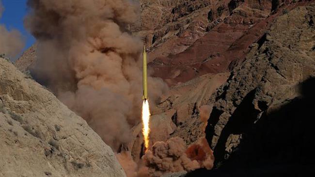 In this March 9, 2016 photo, a Qadr H long-range surface-to-surface missile is fired by Iranian Armed Forces. (Photo by Fars news agency)