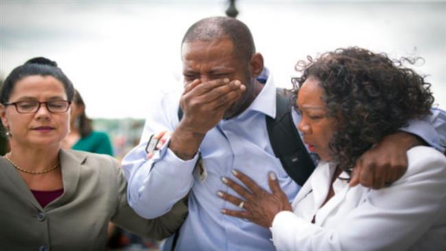 Family and friends of Valerie Castile and Philando Castile, including John Thompson, center, wept as he walked out of the courthouse on Friday, June 16, 2017. (Photo by AP)