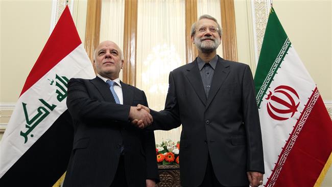 Iranian Parliament Speaker Ali Larijani (R) and Iraqi Prime Minister Haider al-Abadi shake hands prior to their meeting in Tehran on June 21, 2017. (Photos by IRNA)