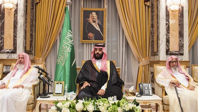 A handout photo made available by the Saudi press Agency (SPA) late on June 21, 2017, shows Saudi Crown Prince Mohammed bin Salman sitting as royal family members and other official pledge allegiance to him, at the Royal Palace in Mecca. (Photo by AFP)
