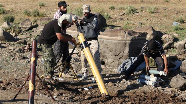 Terrorists prepare to fire mortar shells towards Syrian forces in Quneitra Province, bordering the Israeli-occupied Golan Heights, June 24, 2017. (Photo by Reuters)