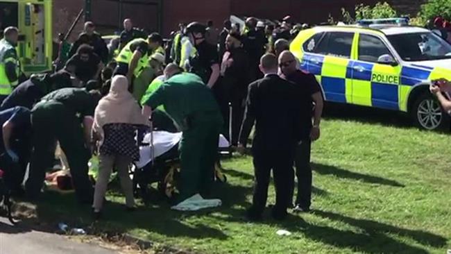 Medics attend the injured after a car ran over people attending a Muslim celebration, New Castle, June 25, 2017. (Photo from social media)