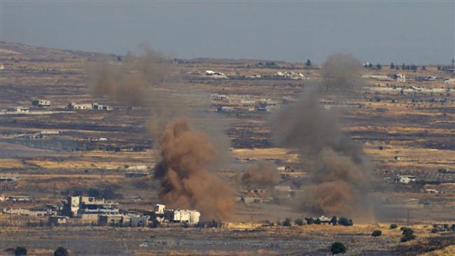 A picture taken from the Israeli-occupied Golan Heights shows smoke billowing from the Syrian side of the border on June 25, 2017. (Photo by AFP)
